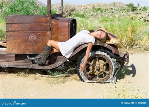 Country Girl Lying On Hay With Laptop Royalty Free Stock Image