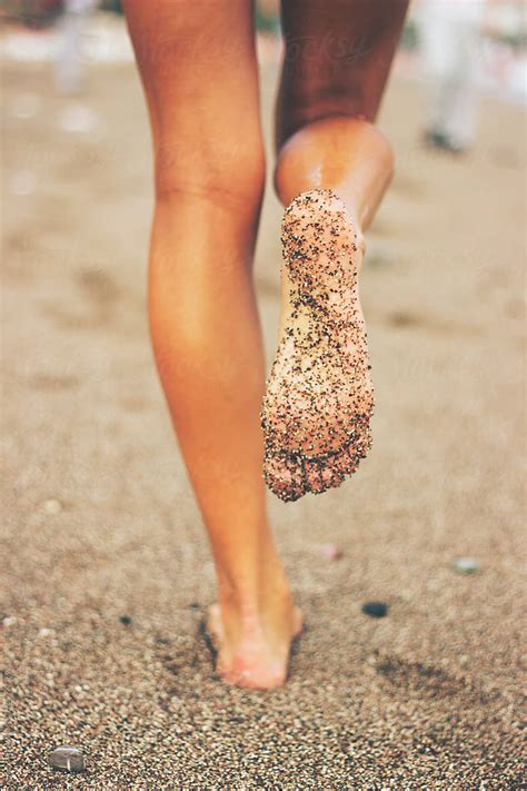 Female Feet On The Beach Covered In Sand By Jovana Rikalo Stocksy United