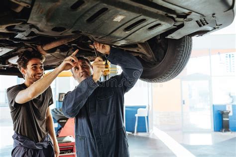 Auto Mechanics Fixing A Car In Garage Stock Photo Image Of Repair