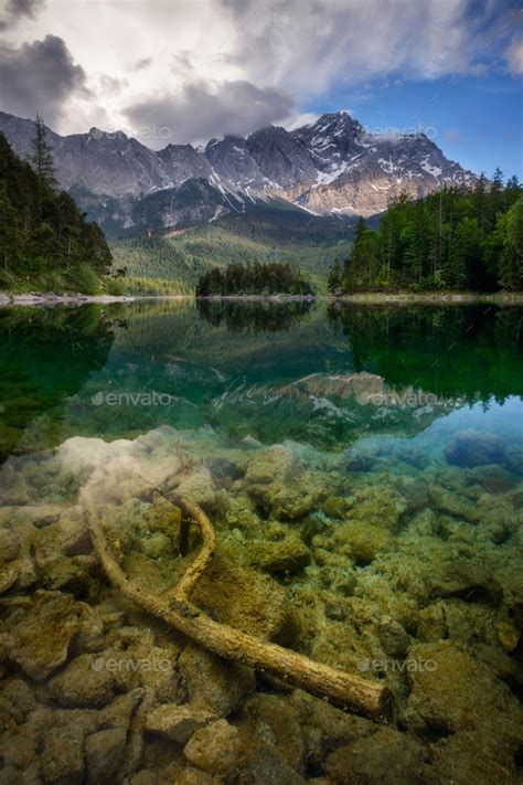 Beautiful Reflection Of Highest Mountain Peak Zugspitze At Eibsee Lake