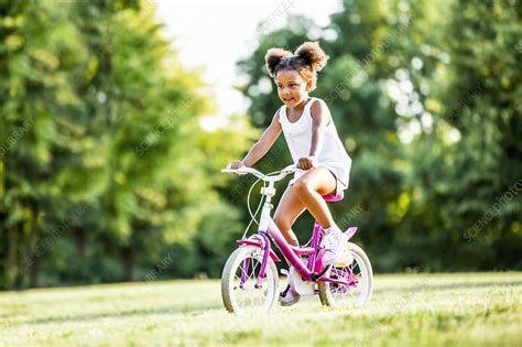 Girl Riding Bicycle Stock Image F0226989 Science Photo Library