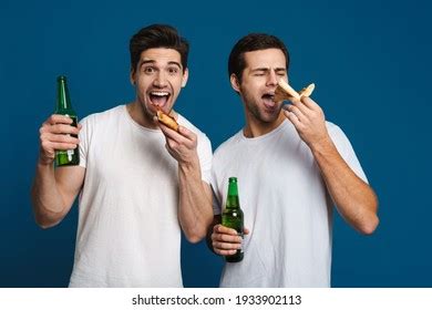 Excited Unshaven Two Guys Eating Pizza Stock Photo Edit Now
