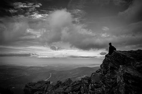 Hd Wallpaper Man Sitting On Rocky Cliff Looking At Mountains In