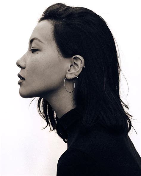 A Black And White Photo Of A Womans Profile With Her Eyes Closed To
