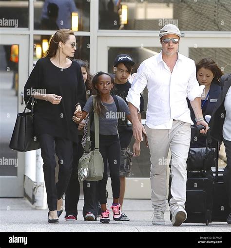 Brad Pitt And Angelina Jolie Arrive At Los Angeles International Lax Airport With Their