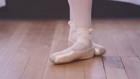 Close Up Of A Ballet Dancers Feet As She Practices Point Exercises