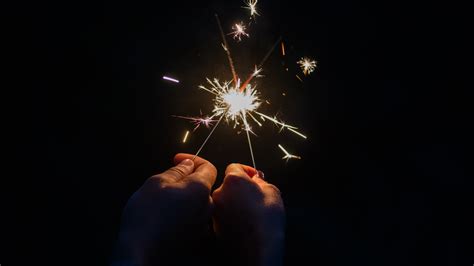 Wallpaper Sparks Fireworks Two Hands Night 5120x2880 Uhd 5k Picture
