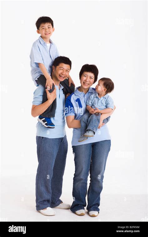 Portrait Of A Mid Adult Couple With Their Two Sons Stock Photo Alamy