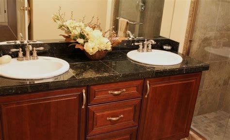 The ring around the sink matches the tile used as the countertop edge, and the light shade used on the countertop blends nicely with the white paneling on the sides. Bahtroom Bathroom Tile Countertop Ideas and Buying Guide ...