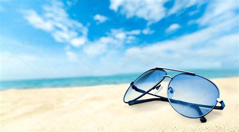 Sunglasses On Sandy Beach Stock Photo By ©billiondigital 114725848