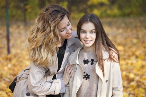 Mother And Daughter Are Walking In The Autumn Park Stock Image Image Of Bright Fall 131584451