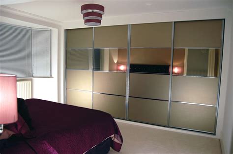 Dressed in a delightfully glossy white. Sliding door wardrobes; Fitted wardrobes; Bournemouth ...