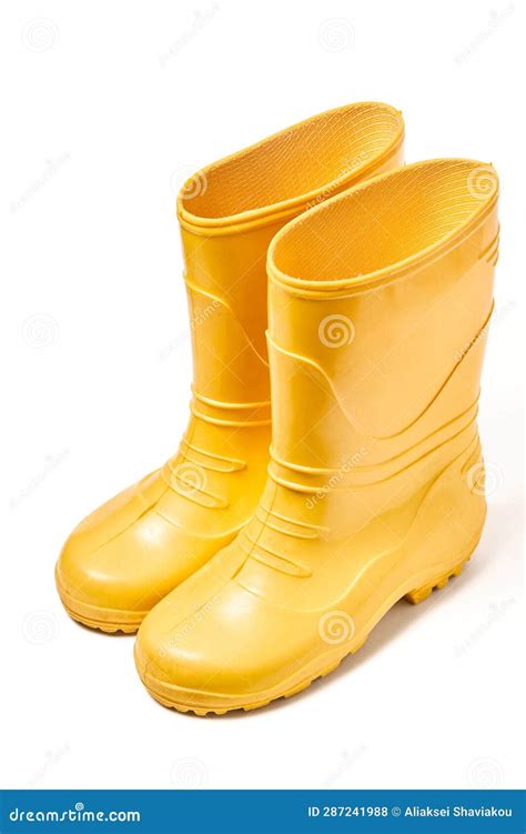 Pair Of Yellow Rubber Boots For Kids Isolated On White Background Stock