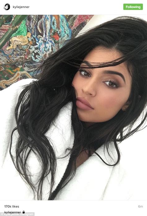 Kylie Jenner Shows Off Signature Pucker While In A White Robe Daily