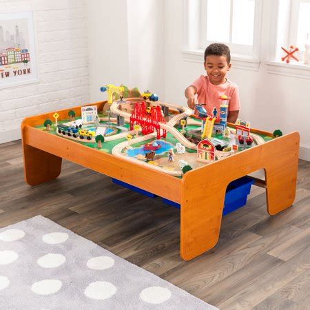 Passengers wave to the smiling townsfolk as they zip by. KidKraft Ride Around Town Train Set & Table with 100 ...