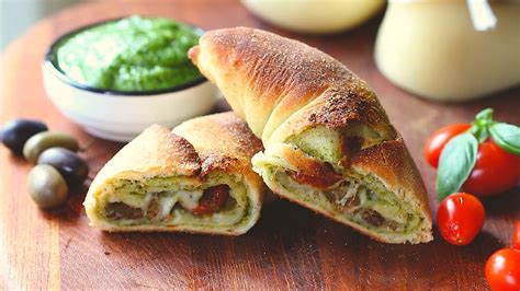 Calzone Pizza With Pesto Tomatoes Cheese And Olives Recipe Recipe Flow