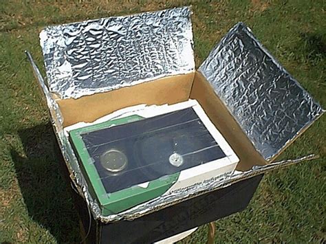 Place your food inside the small box and set the glass into place. Solar Cooker made from cardboard box and foil. | Solar ...