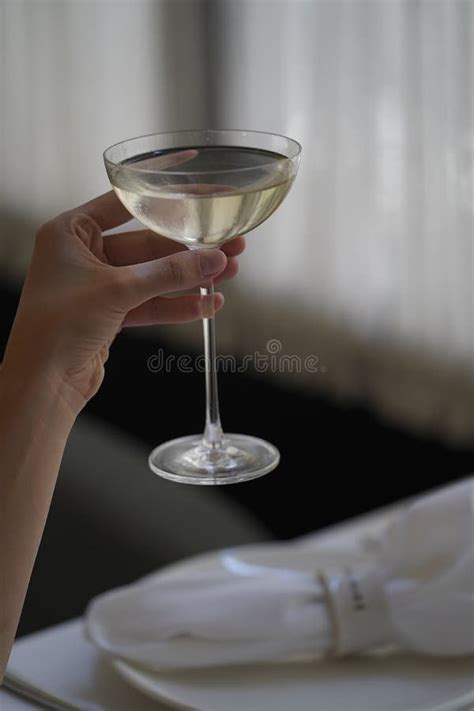 Woman Hand Holding Glass With Martini Cocktail Close Up Stock Image