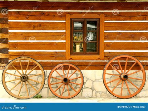 Wooden Wheels At Cottage Wall Stock Photo Image Of Classic