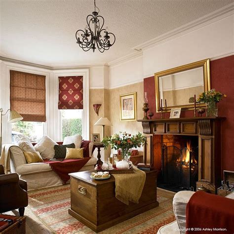 You can make your living room as brown as you want, from flooring, to furniture, walls and even lighting fixtures, such as a hanging chandelier or side lamps. I love the red on one wall and cream the rest .My funiture is brown. I think this would work ...