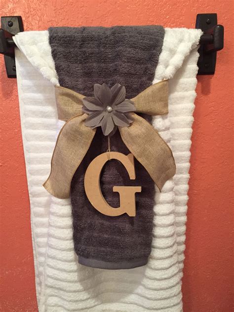 You can mix neatly folded towels with a laundry basket at the bottom, and even display houseplants on top. Bath towel display, bathroom make over | Bath towels ...