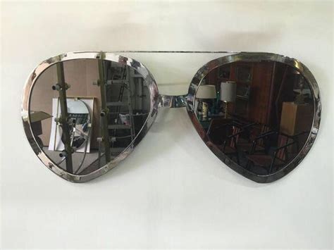 huge pair of aviator glasses wall mirror in chromed frame on mirror wall mirror