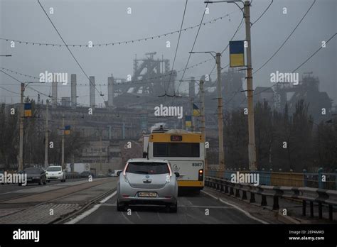 Cars Drive By An Azov Stal Steel Plant Avenue In In Mariupol The Two