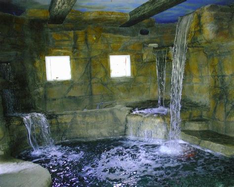 An Indoor Hot Tub With Water Running Down It