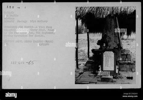 Caption: "Viet Cong memorial honoring their dead, found by the 2nd