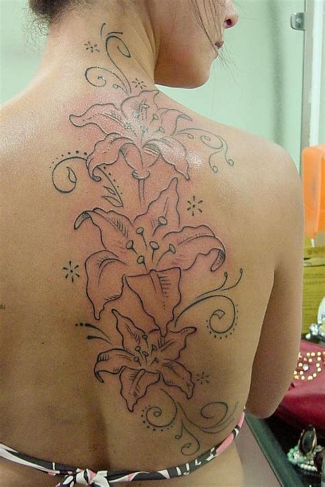 A very clean and colorful arm tattoo. 55+ Awesome Lily Tattoo Designs | Art and Design