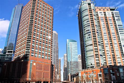 Free Stock Photo Of Tall Brick And Glass Buildings In City
