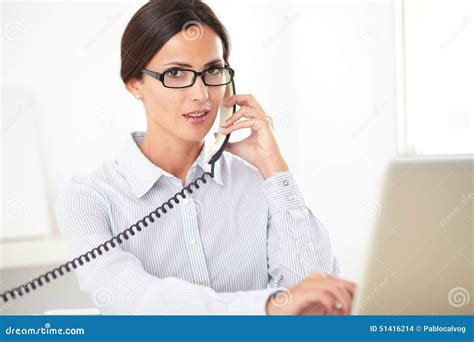 Pretty Receptionist Using The Phone At Workplace Stock Photo Image Of