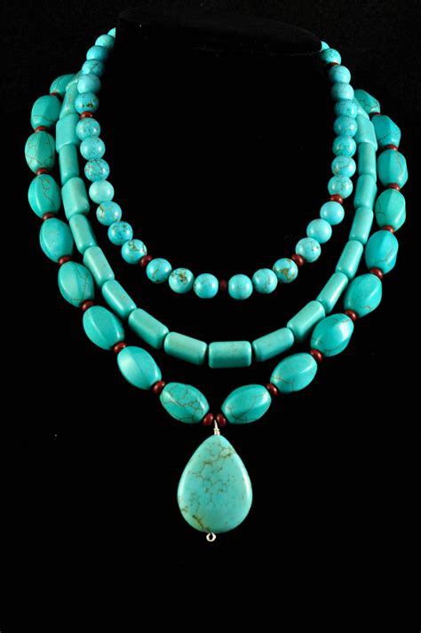 three different turquoise necklace that can be worn as one or with all three collares