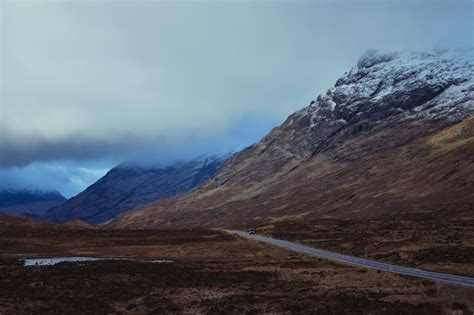 Premium Photo A Road Leading Through The Scottish Highlands Of Glen