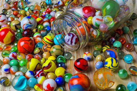 Jar Spilling Colorful Marbles Photograph By Garry Gay