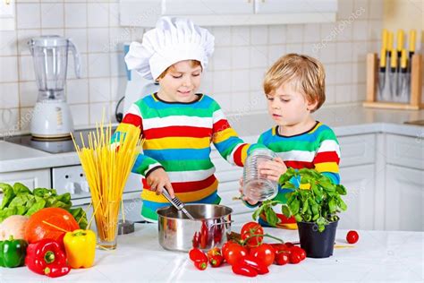 Two Little Kid Boys Cooking Pasta With Vegetables — Stock Photo