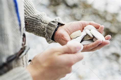 Man Holding Hand Full Of Rocks Stock Photo Offset