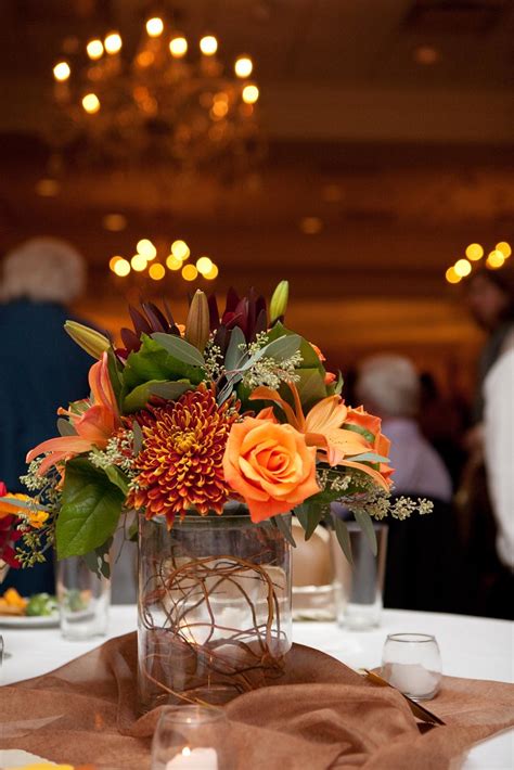 Use complementary colors to your place settings. Fall Centerpiece | Milestones Floral | Flickr