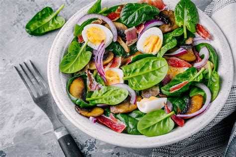 Boiled fingerling potatoes are served with spinach, mint leaves, and salmon in this hearty salad recipe that's apt for lunch or dinner. Warm Spinach Salad With Bacon Dressing Recipe