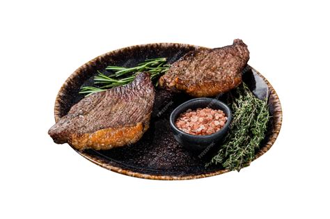 Premium Photo Brazilian Bbq Grilled Dry Aged Picanha Beef Steak With Herbs Isolated On White