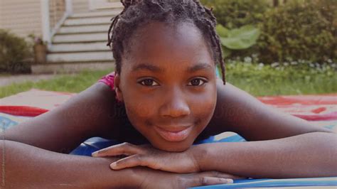 black girl smiling by stocksy contributor gabi bucataru stocksy