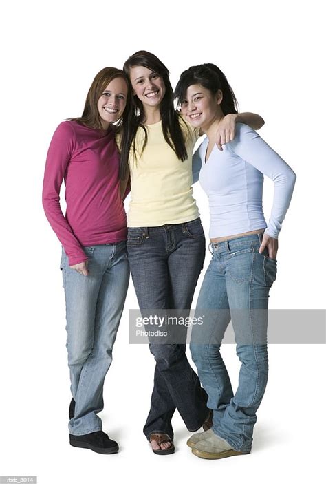 Portrait Of Three Teenage Girls Standing Together Smiling High Res