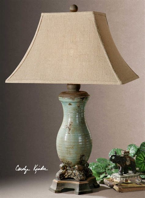 The rectangle bell shade is a taupe linen textile. Andelle Distressed Lamp | Metal table lamps, Blue table ...