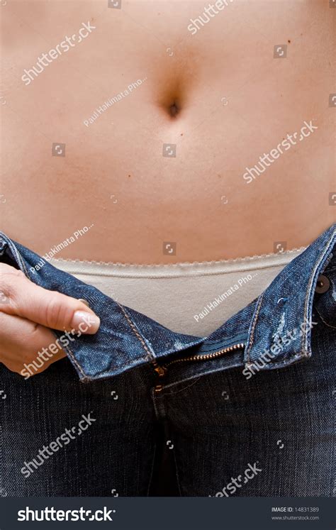 Closeup Stomach Woman With Jeans Unzipped Hands Holding 45 Off