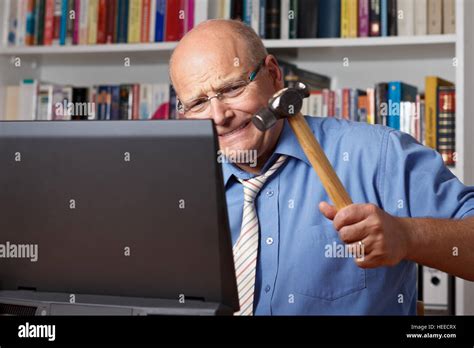 Very Angry Old Man With Shirt And Tie Hitting His Computer With A
