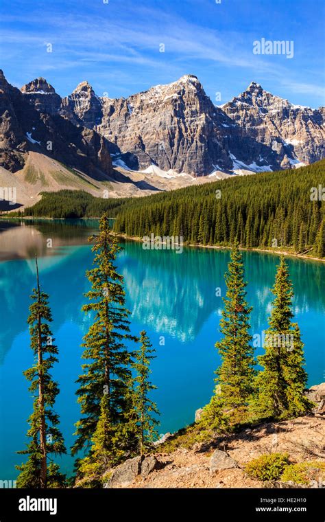 The Majestic Wenkchemna Peaks Tower Above A Turquoise Moraine Lake In