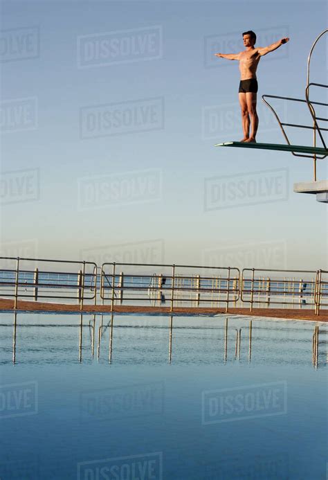 A Diver Standing On A Diving Board Stock Photo Dissolve