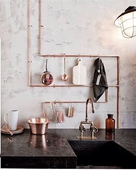 8 Creative Ways To Hide Exposed Pipes Housessive Modern Kitchen Storage Apartment Therapy