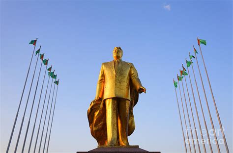 Golden Statue Of Niyazov In The Park Of Independence In Ashgabat