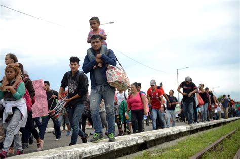 Migrant caravan shrinks as some accept bus rides home